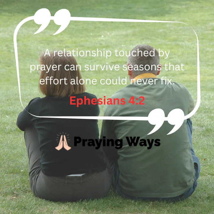 The back view of a mature couple sitting close together on a green grassy lawn. An overlaid white quote bubble contains the text, "A relationship touched by prayer can survive seasons that effort alone could never fix," with a red scripture citation for Ephesians 4:22