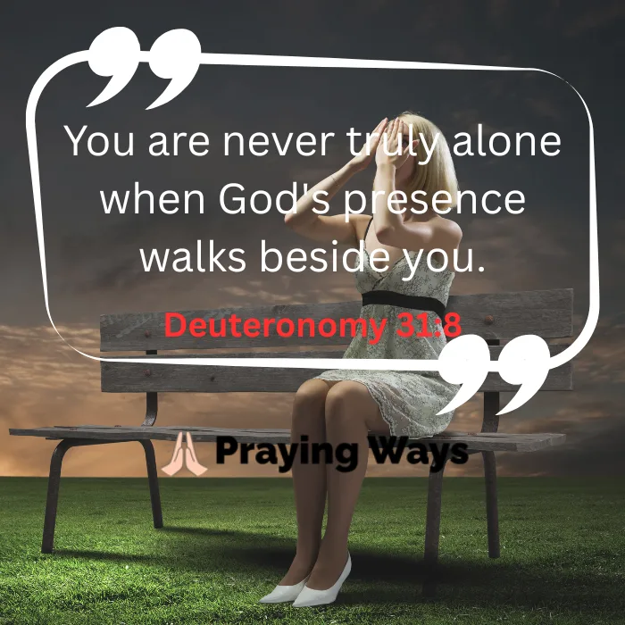 An image quote featuring Deuteronomy 31:8 that reads, 'You are never truly alone when God's presence walks beside you.' The background shows a woman sitting alone on a park bench covering her face with her hands under a dramatic sky
