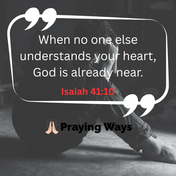 An image quote featuring Isaiah 41:10 that reads, 'When no one else understands your heart, God is already near.' It shows a black and white silhouette of a person sitting on the floor with their head in their hands,