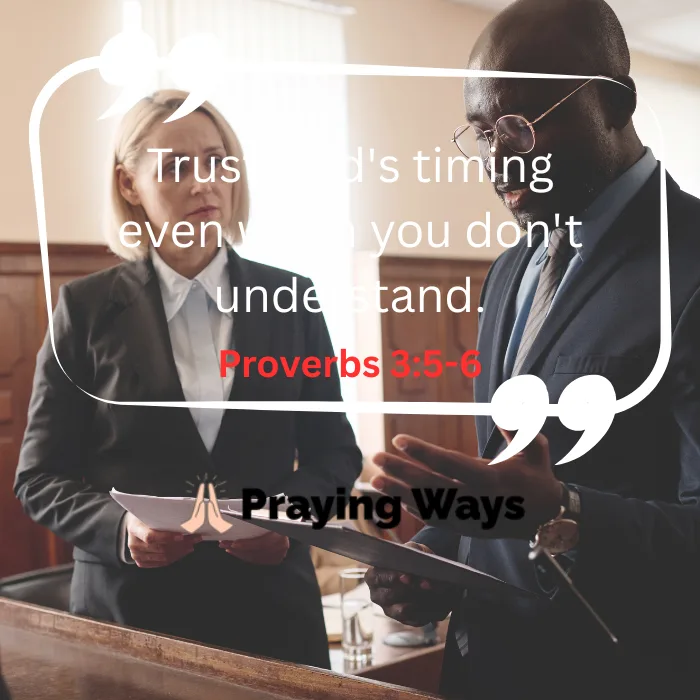 A Christian motivational graphic with the text "Trust God's timing even when you don't understand. Proverbs 3:5-6" by Praying Ways, with a background image showing a male and female lawyer in business suits reviewing legal documents together inside a courtroom.